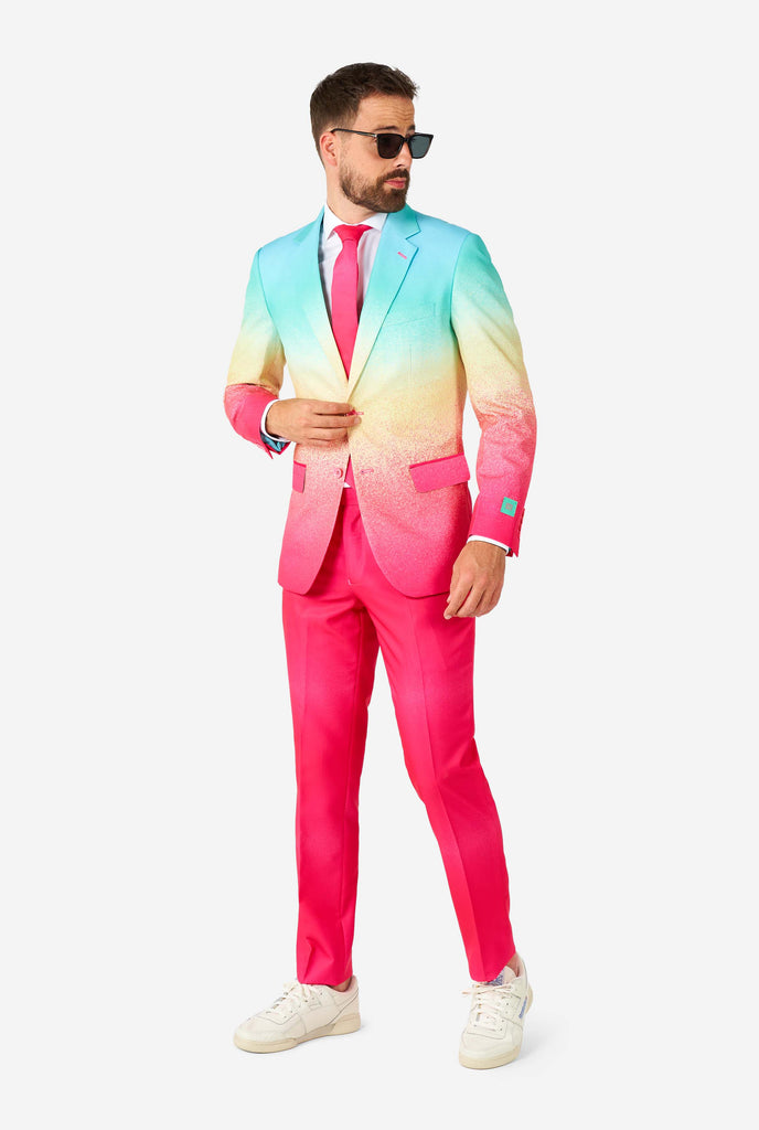 Man wearing rainbow colored suit