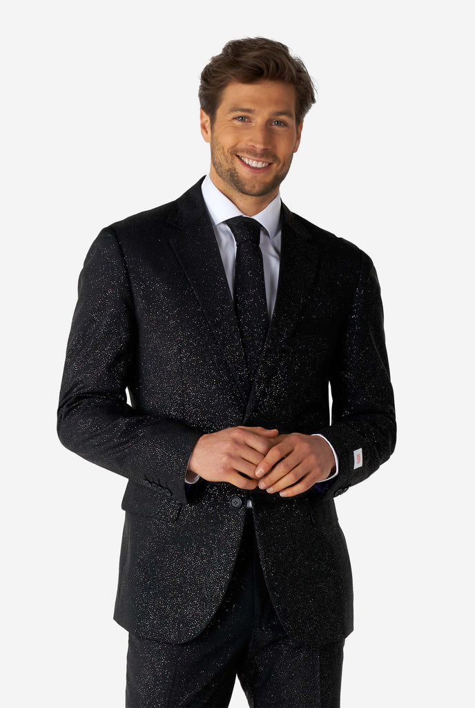 Man wearing black suit with glitter