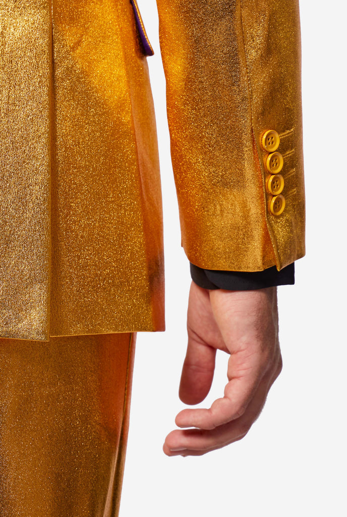 Gold men's party suit worn by man, sleeve close up