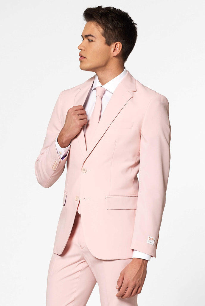 Man wearing pastel pink colored men's suit