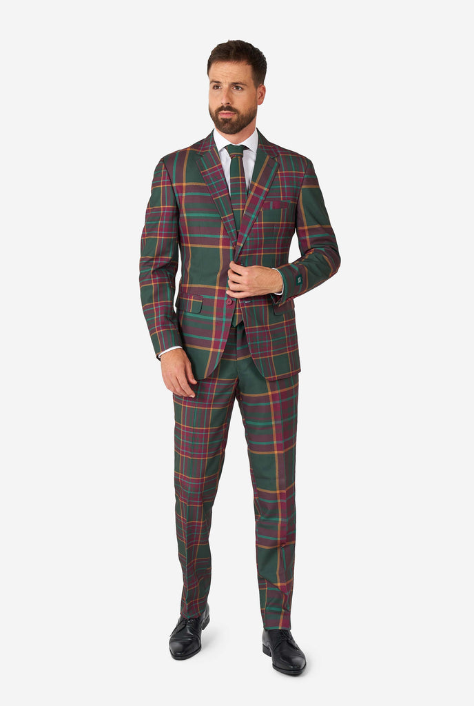 Man wearing a tartan plaid Christmas suit