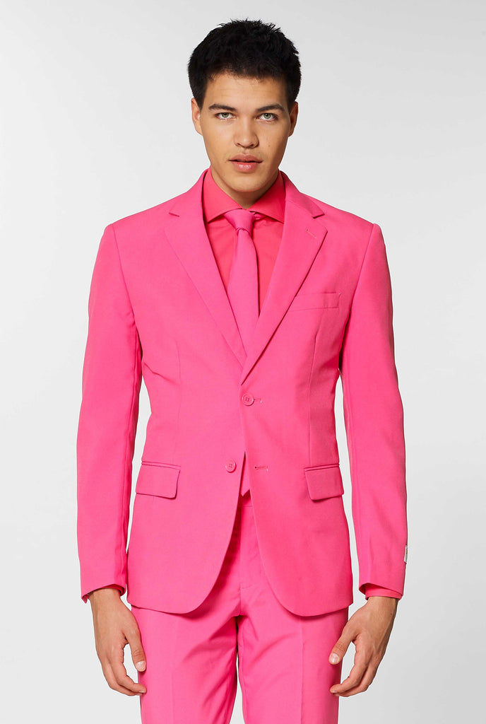 Man wearing pink men's suit with pink dress shirt