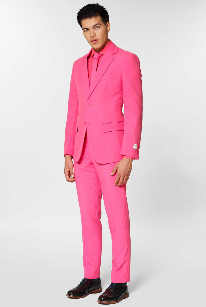 Man wearing pink men's suit with pink dress shirt