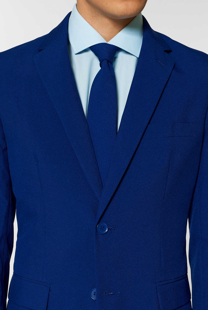 Navy blue men's suit worn by man up close