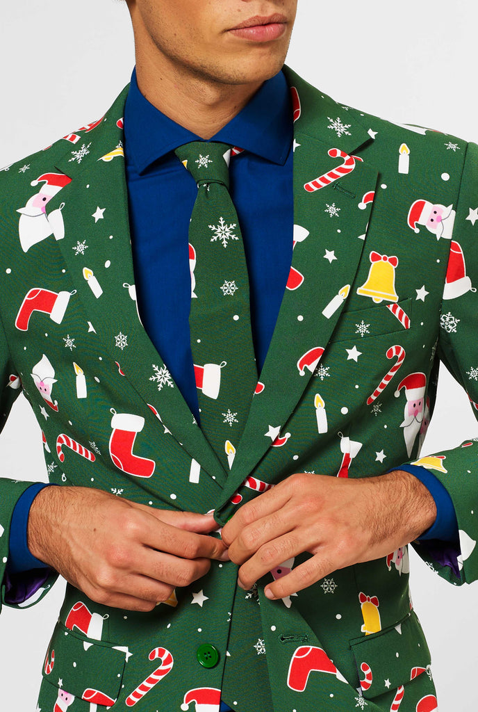 Man wearing green Christmas suit and blue dress shirt, close up