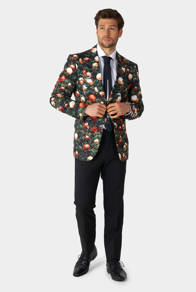 Man wearing Christmas suit with Christmas tree print