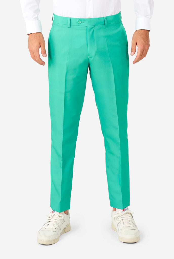 Man wearing turquoise colored suit, pants view