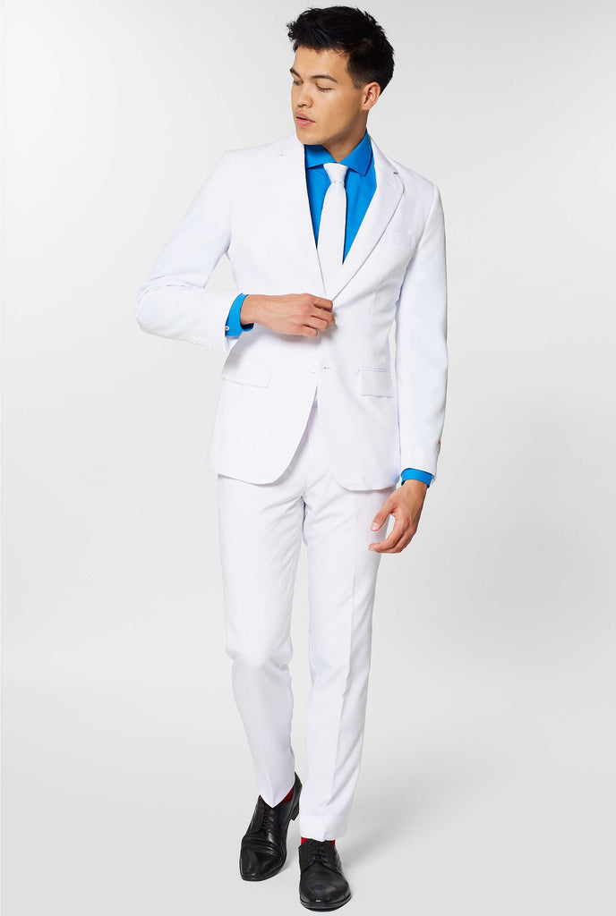 All white men's suit worn by man