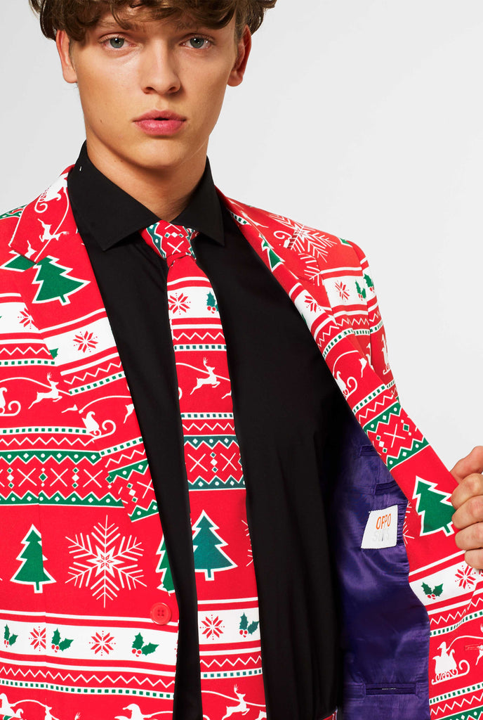 Man wearing red Christmas suit and black dress shirt, close up