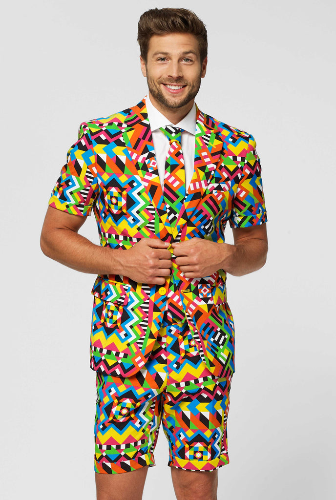Man wearing colorful summer suit, consisting of short, jacket and tie