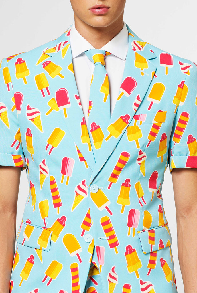 Man wearing light blue summer suit with popsicle print, close up