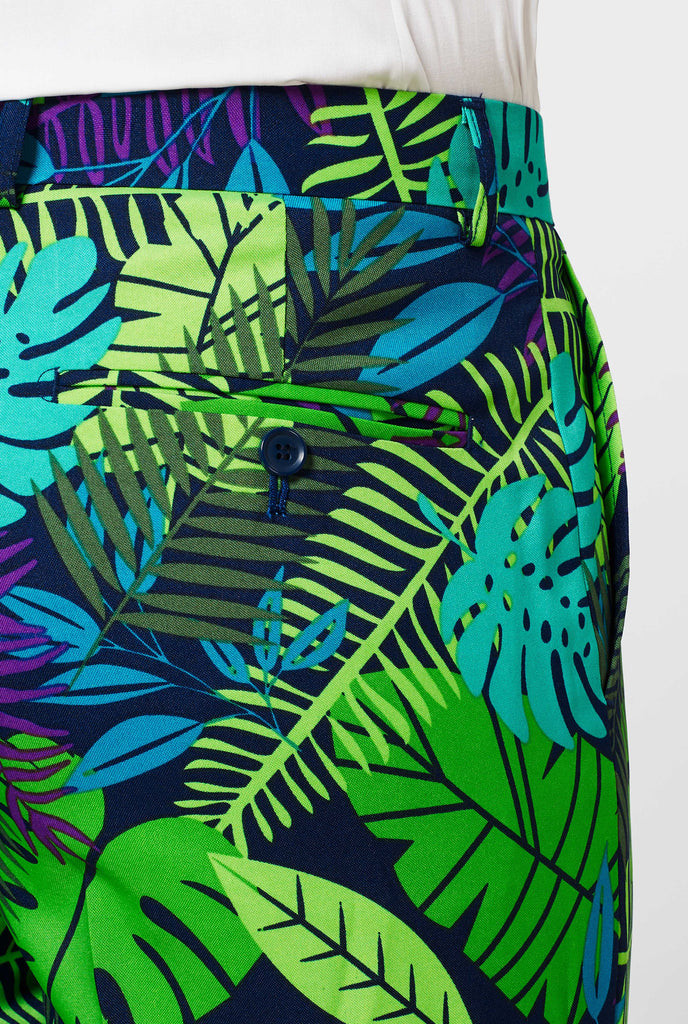 Man wearing green summer suit with jungle leaf print, close up