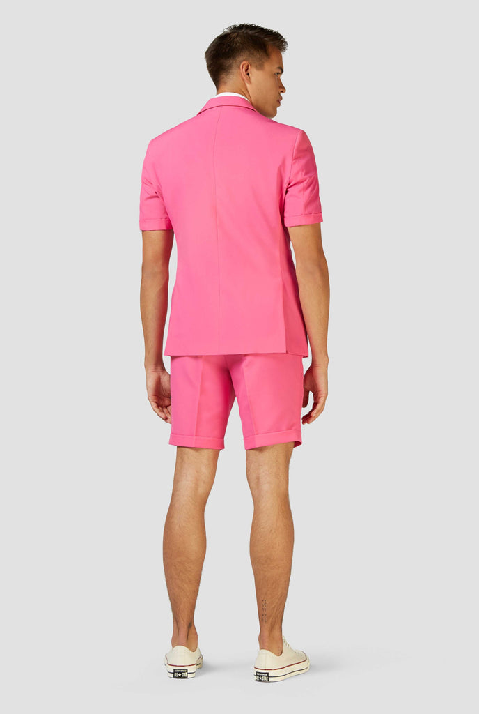 Man wearing pink summer suit, view from the back