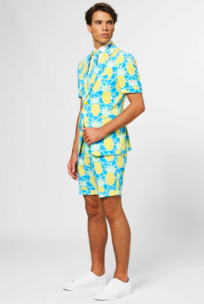 Man wearing blue summer suit with pineapple print