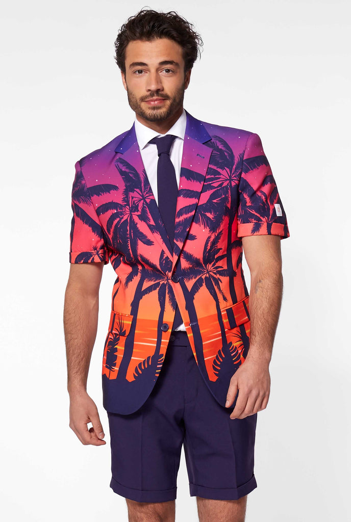 Man wearing summer suit with palms and sunset print