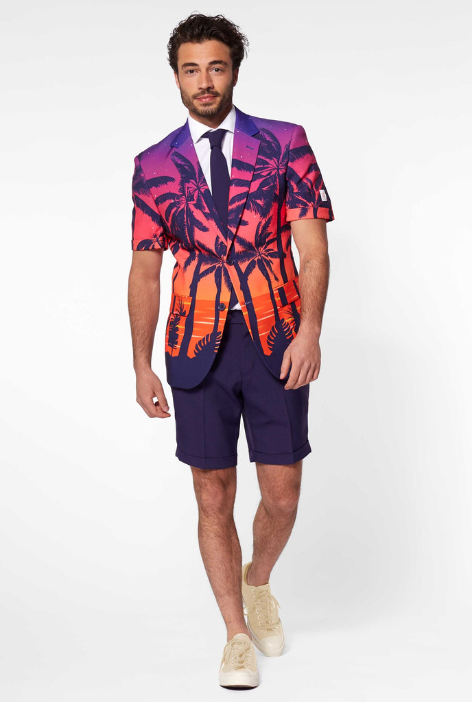 Man wearing summer suit with palms and sunset print