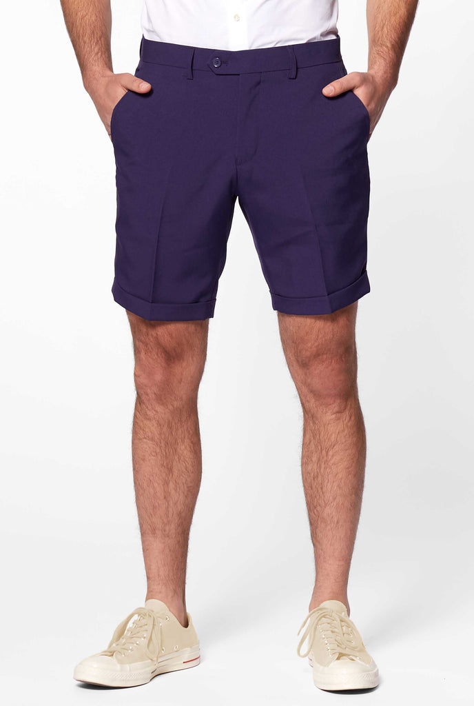 Man wearing blue shorts