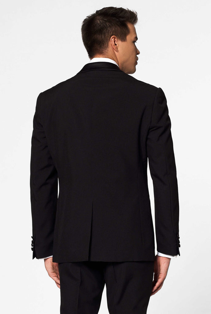 Solid black tuxedo suit Jet Set Black worn by man backside jacket