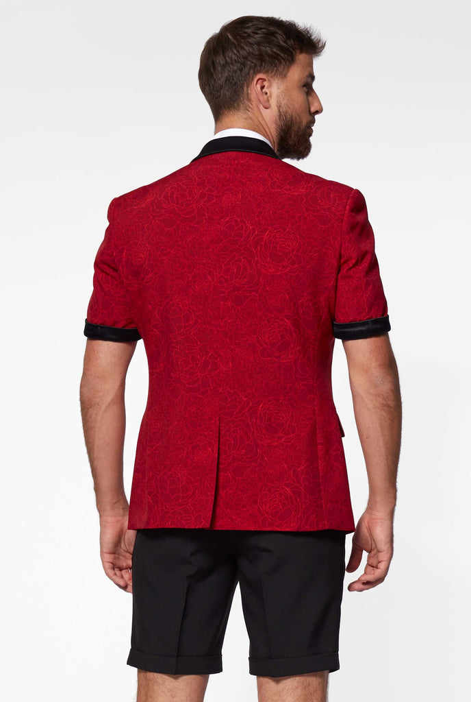 Man wearing red summer tuxedo with flower print from back