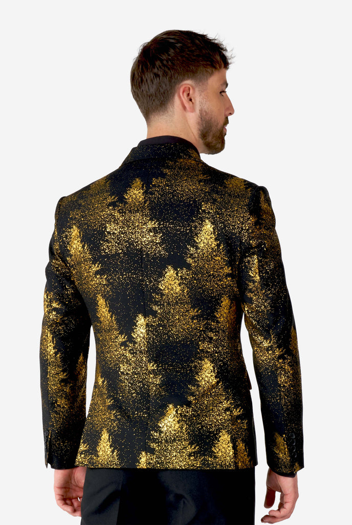 Man wearing black blazer with golden Christmas tree print, view from the back