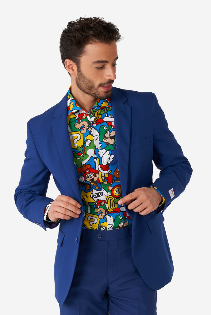 Man wearing dress shirt with Super Mario icons print and blue men's suit