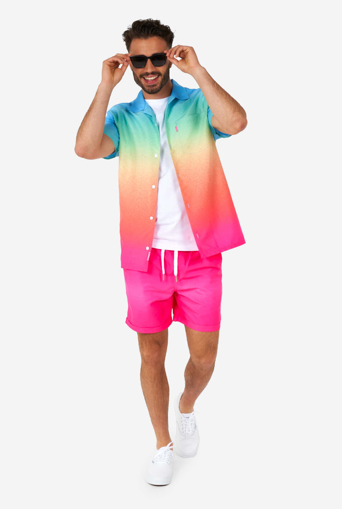 Man wearing colorful summer shorts and shirt