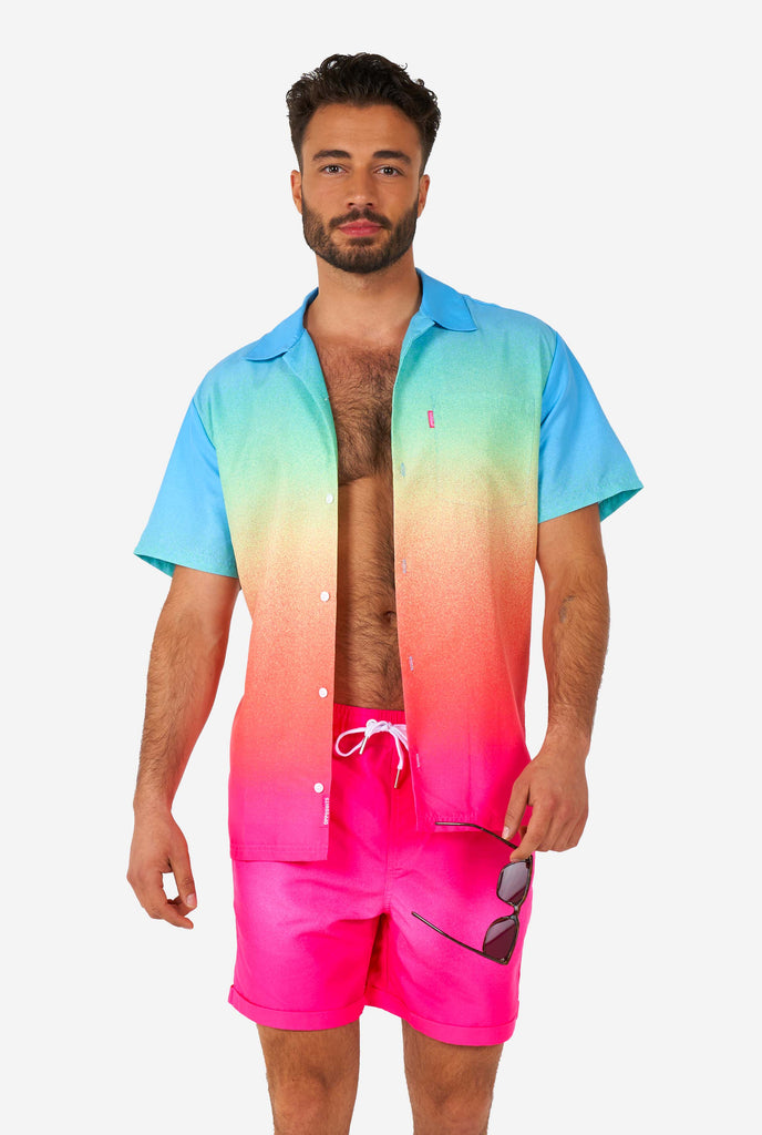 Man wearing colorful summer shorts and shirt