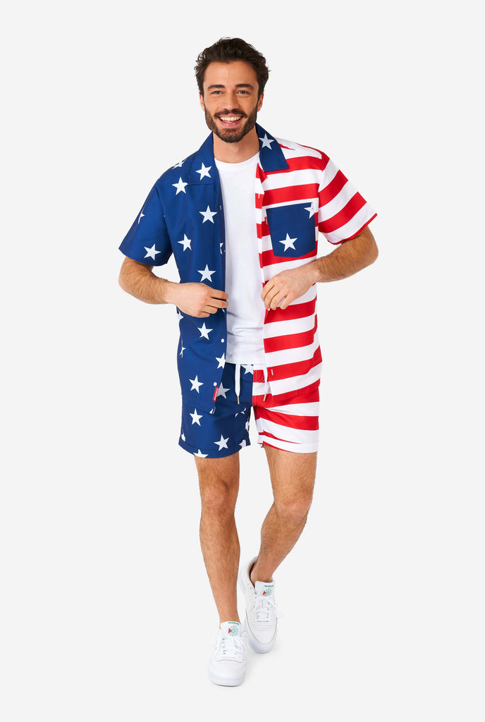 Man wearing summer outfit, consisting of shirt and shorts, with USA flag print