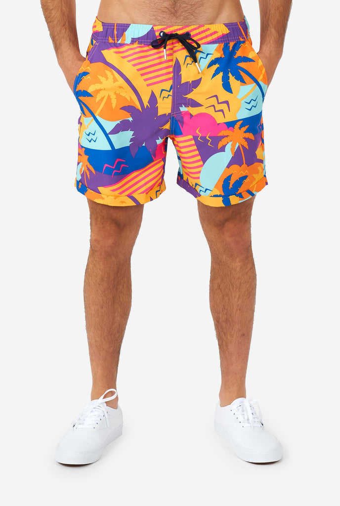 Man wearing colorful summer shorts , close-up