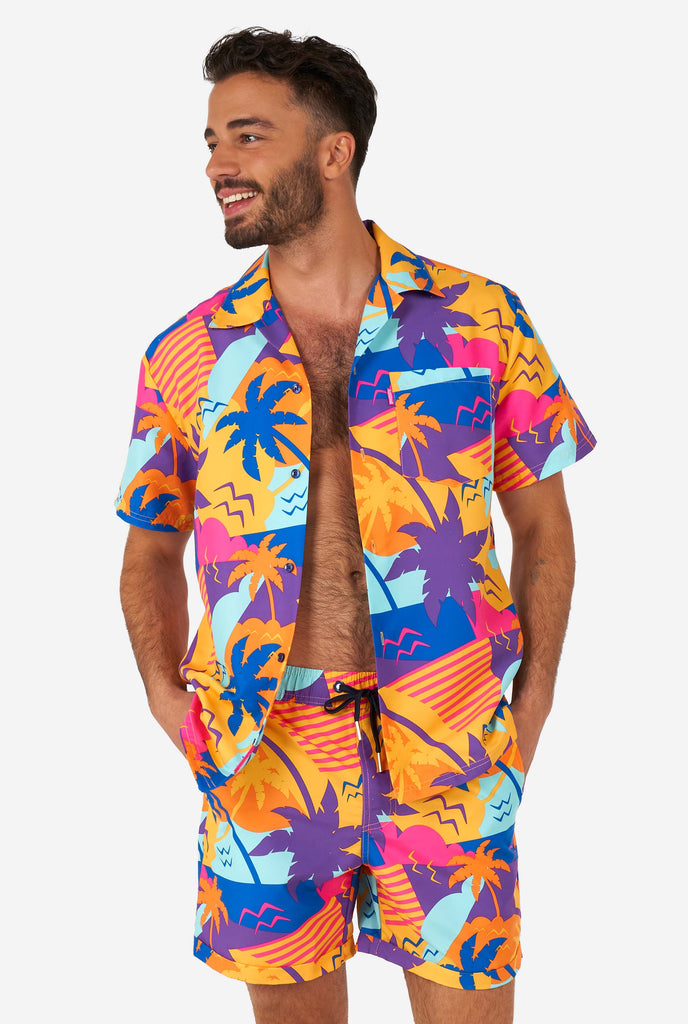 Man wearing colorful summer shorts and shirt