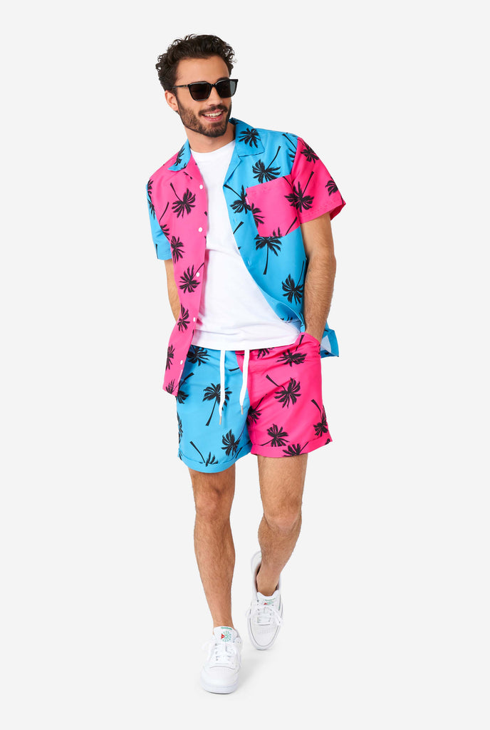 Man wearing summer set consisting of shorts and shirt