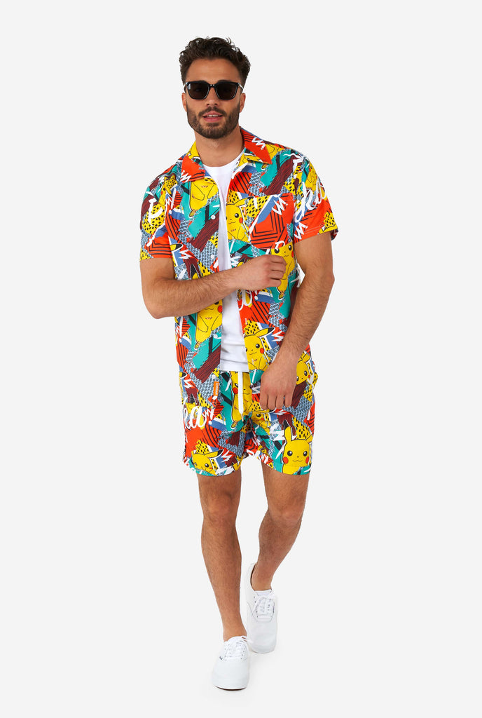 Man wearing colorful summer shorts and shirt with Pikachu Pokemon print