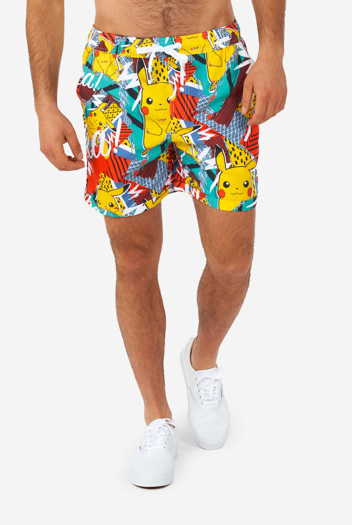 Man wearing colorful summer shorts with Pikachu Pokemon print