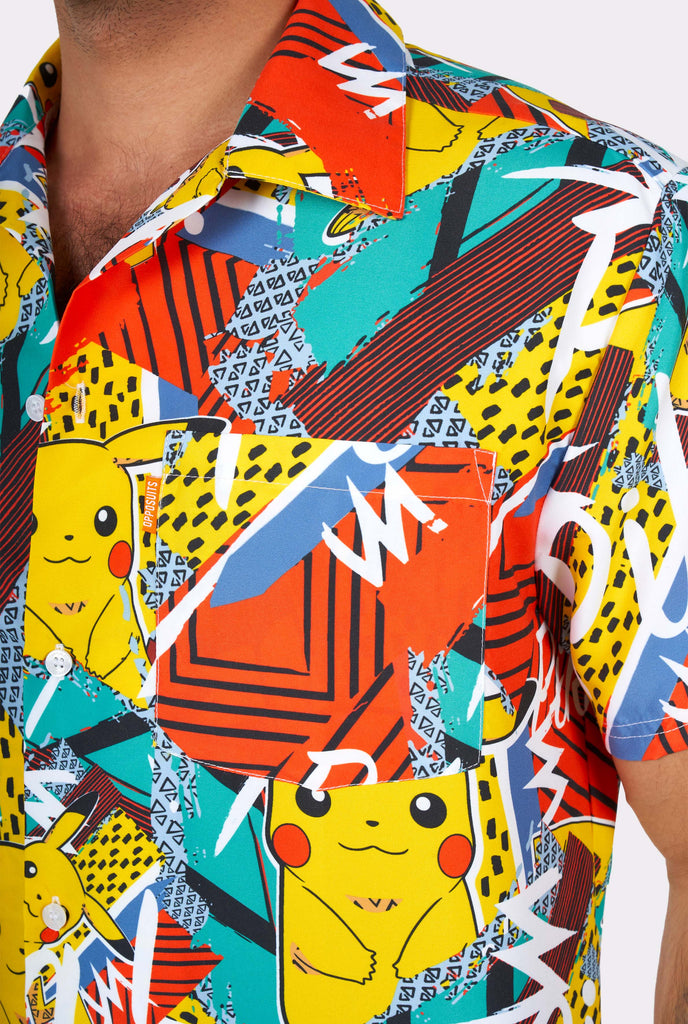 Man wearing colorful summer shirt with Pikachu Pokemon print, close-up