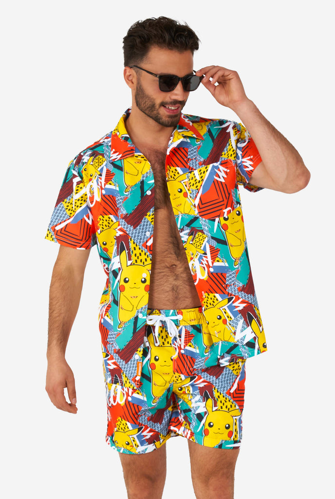 Man wearing colorful summer shorts and shirt with Pikachu Pokemon print