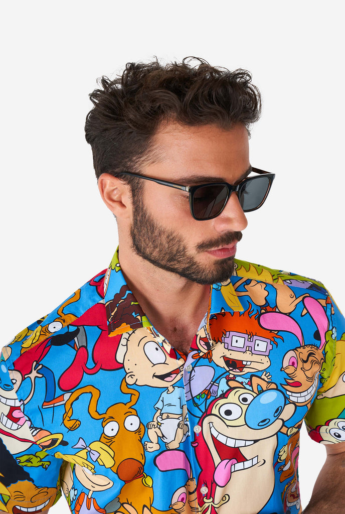 Man wearing summer shirt with Nickelodeon characters print, close up