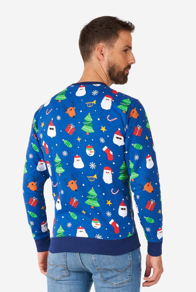 Man wearing blue Christmas sweater with Christmas icons, view from the back