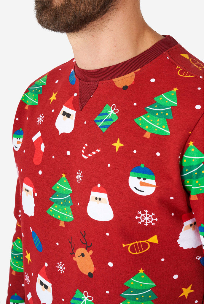 Man wearing red Christmas sweater with Christmas icons, close up