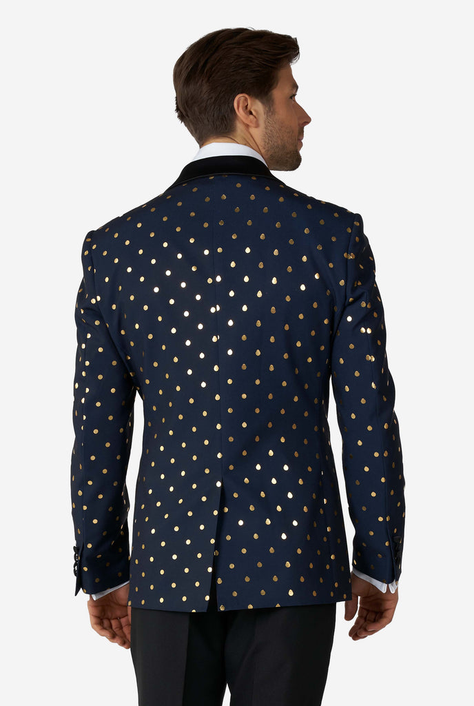 Man wearing blue tuxedo with golden dots, view from the back