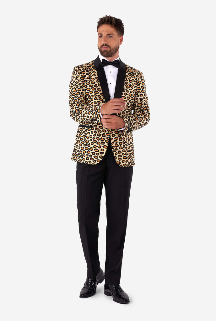 Man wearing tuxedo with jaguar print jacket