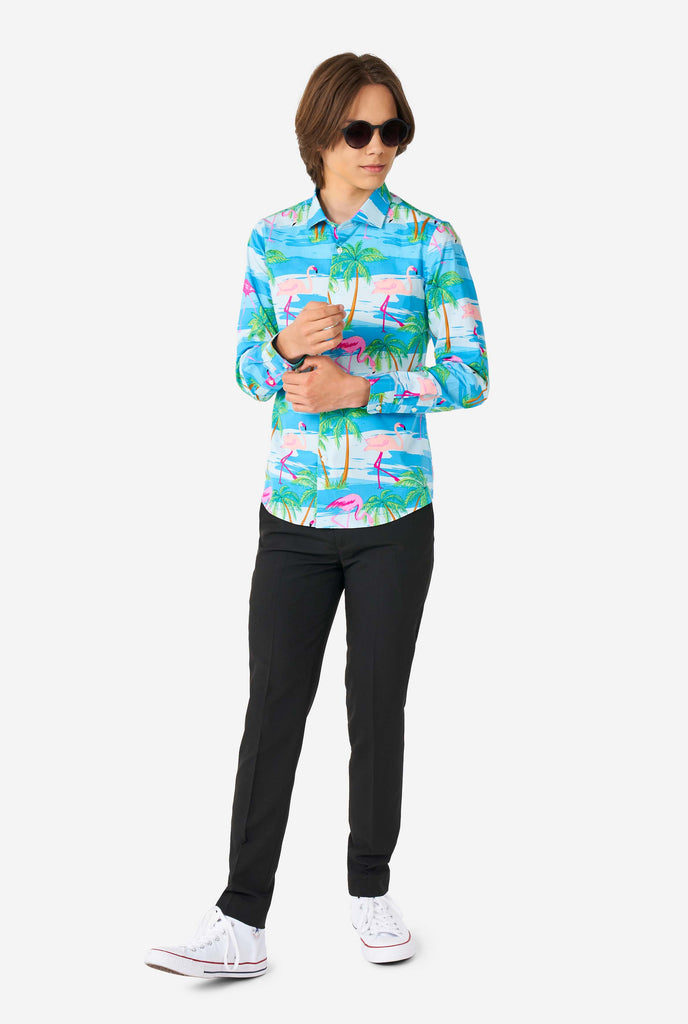 Teen wearing Hawaiian dress shirt with tropical flamingo shirt