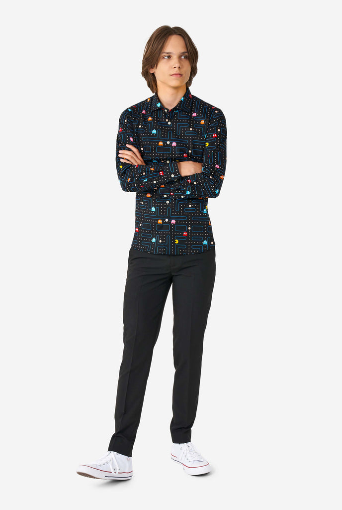 Teen wearing black dress shirt with Pac Man print