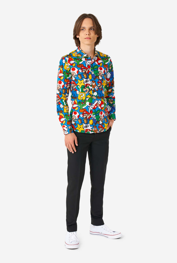 Teen wearing dress shirt with Super Mario print