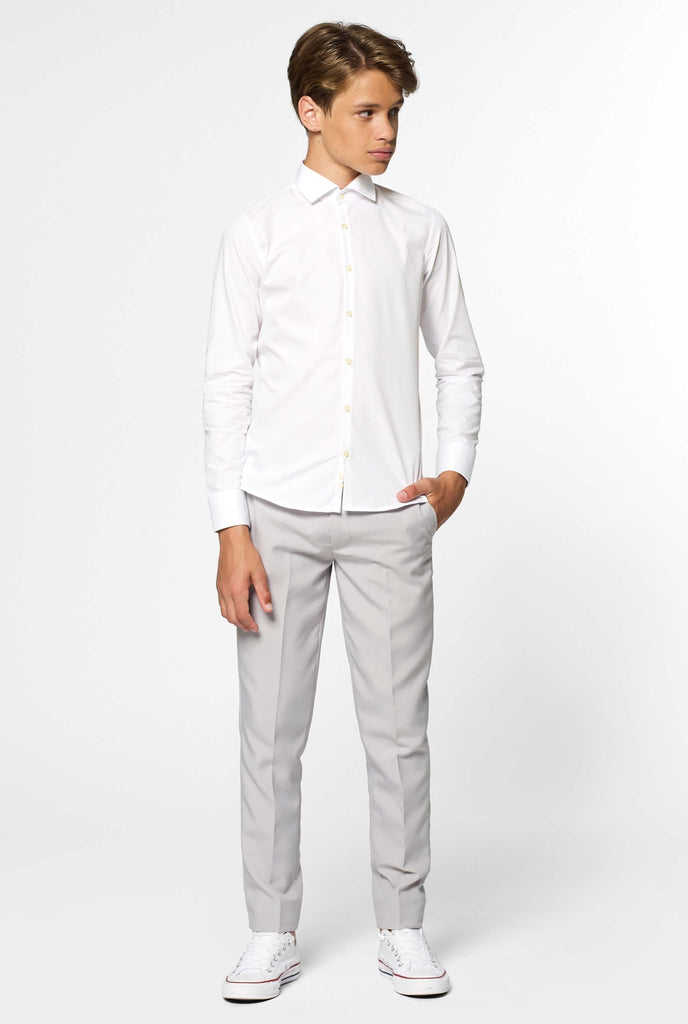 Long sleeve white shirt for boys worn by boy with hand in pocket