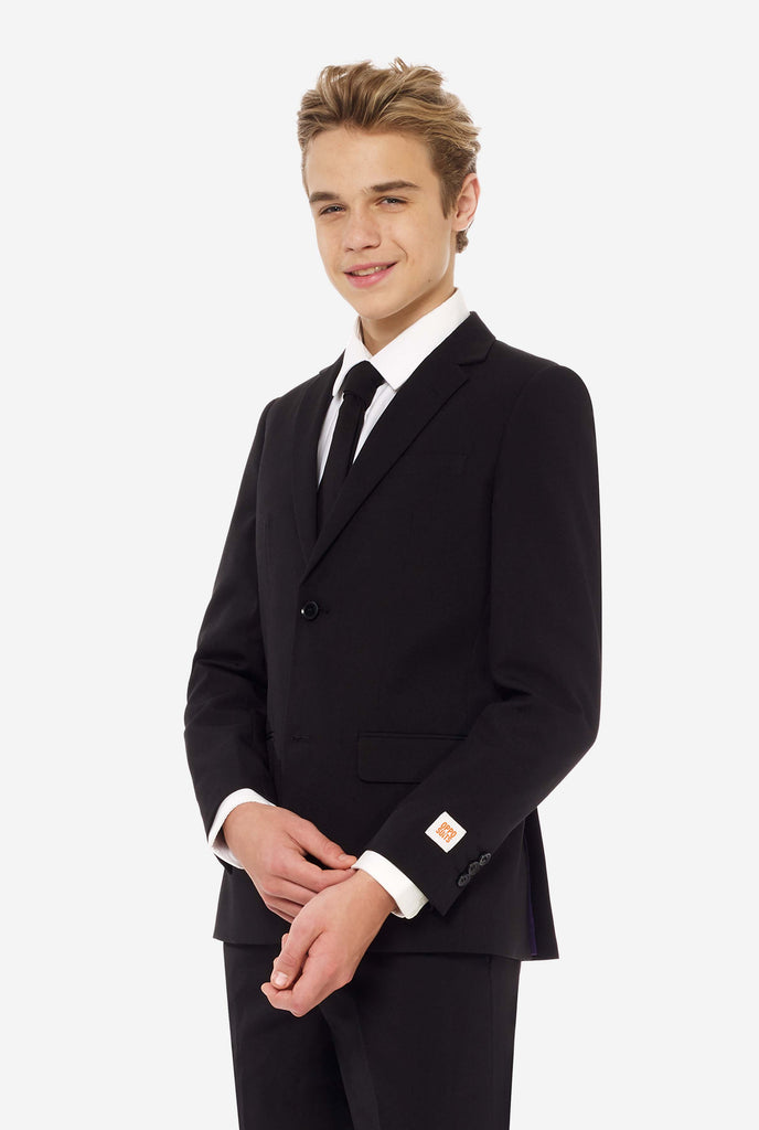 Teen wearing formal black suit