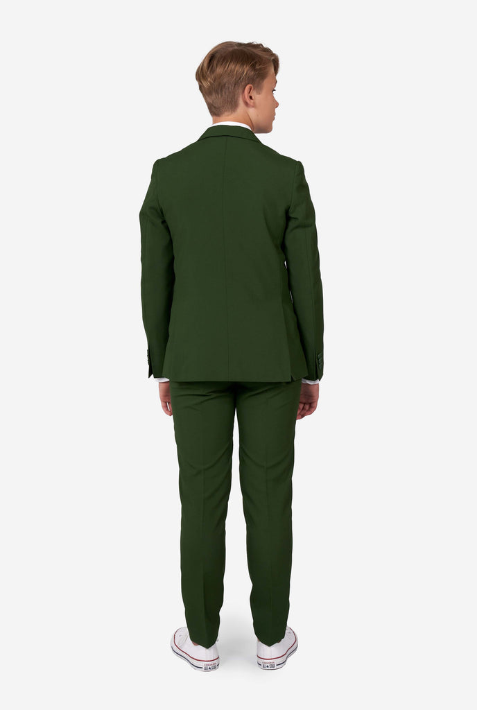 Teen wearing formal dark green suit, view from the back