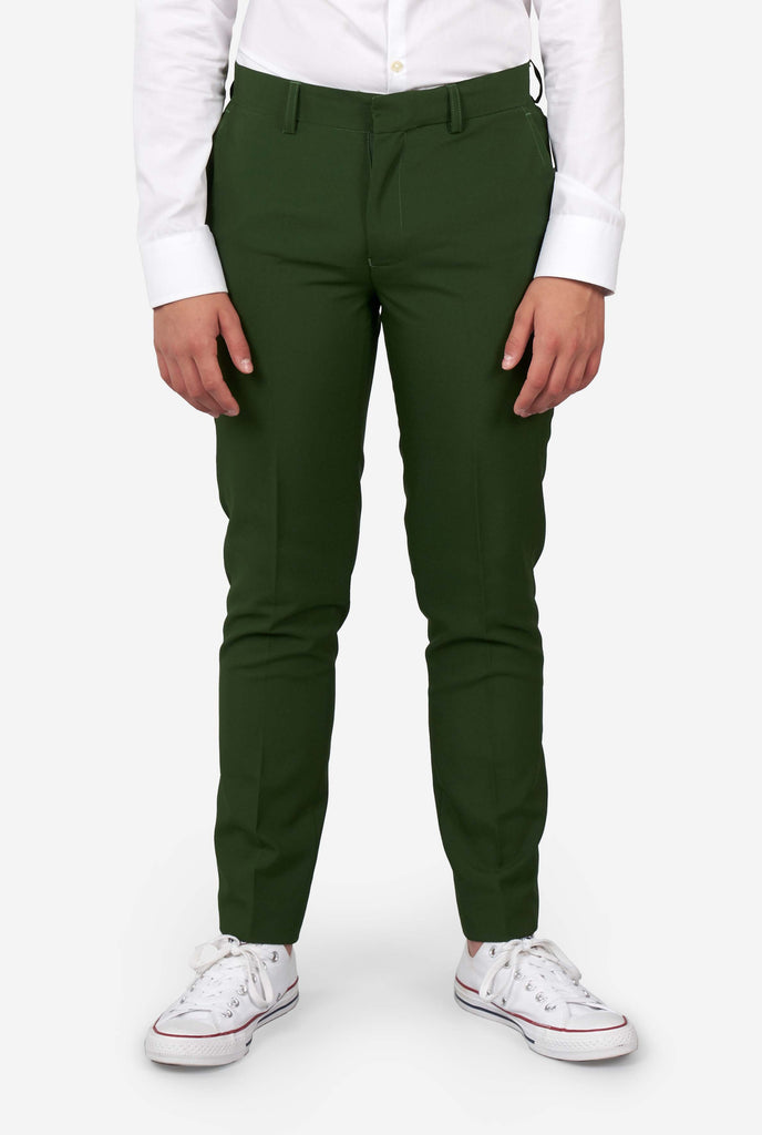 Teen wearing formal dark green suit, zoomed in at pants