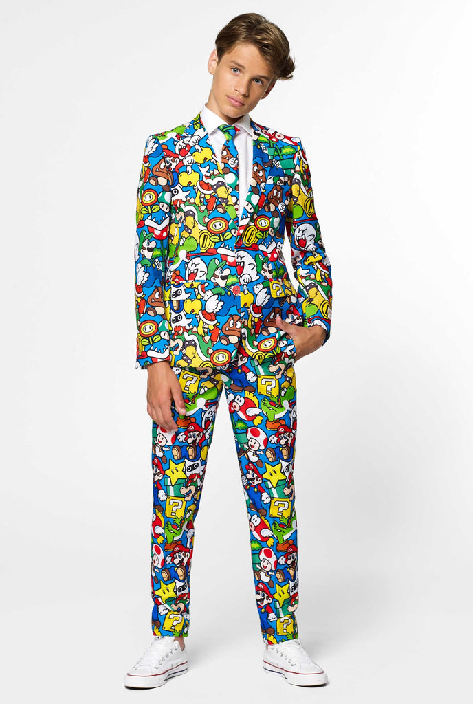 Teen wearing formal suit with colorful Super Mario print