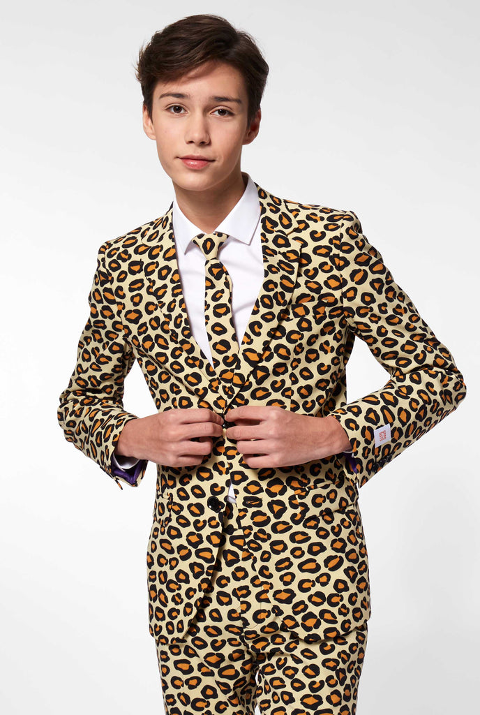 Teen wearing formal suit with panther print