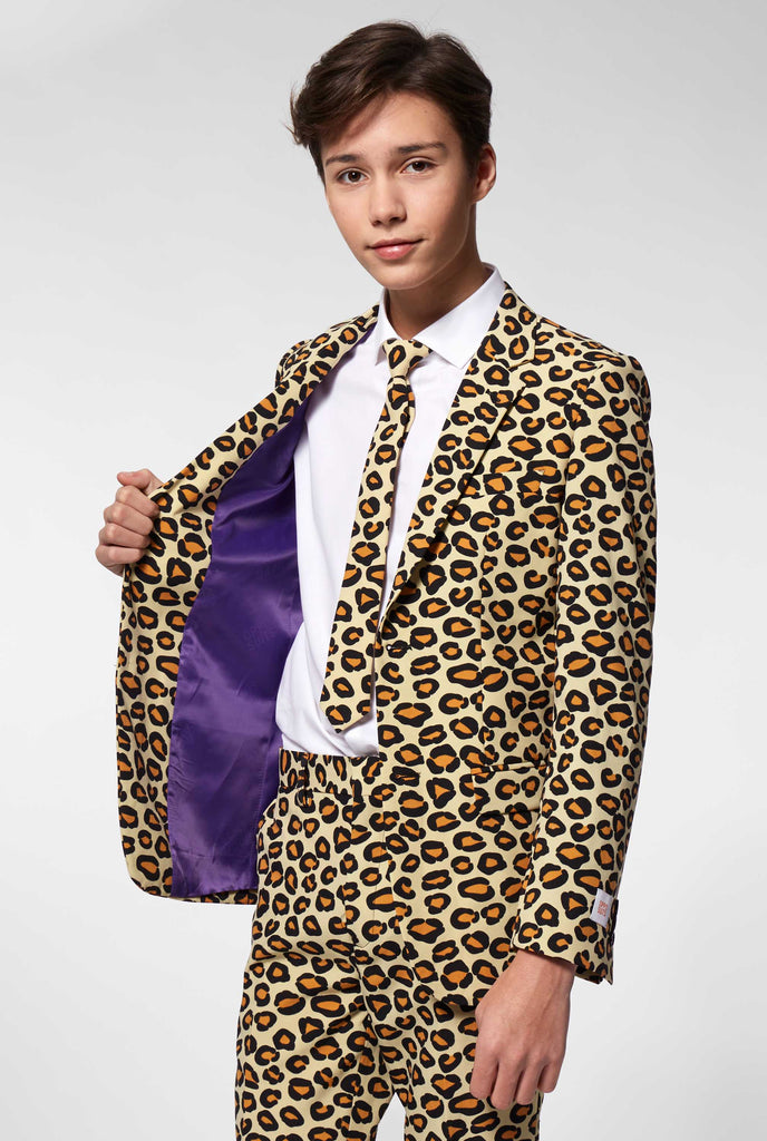 Teen wearing formal suit with panther print